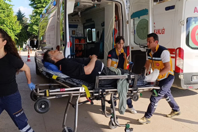 Üzerine iş makinesi devrilen işçi yaralandı
